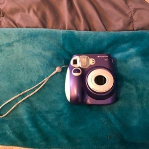 Polaroid camera with film in it